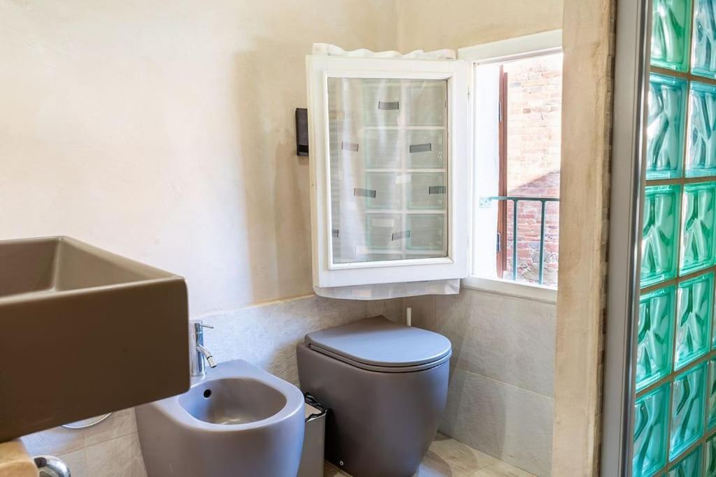 Casa Vacanze L'Angolo Fiorito Bettolle Extérieur photo